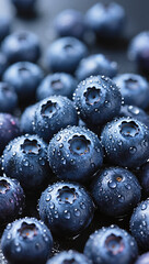 Glossy blueberries in close-up, dewdrops on surface, high detail, dark background, food photography. mobile wallpaper.