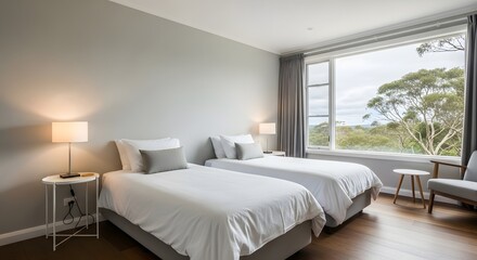 Inviting bedroom with twin beds and serene nature view, perfect for a relaxing getaway