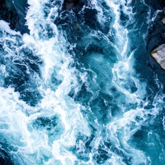 Obraz premium Aerial View of Raging River with White Foamy Rapids on Surface in Natural Light