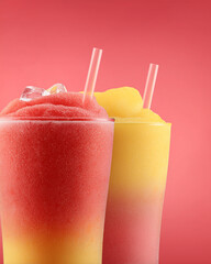 Colorful Tropical Drinks in Tall Glasses with Ice and Straws on White Background