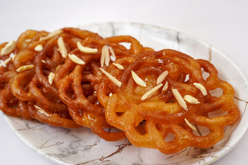 Jalebi famous Indian sweet dessert, traditional Indian Diwali, Holi or Ratha yatra sweets, on the white background. Selective focus