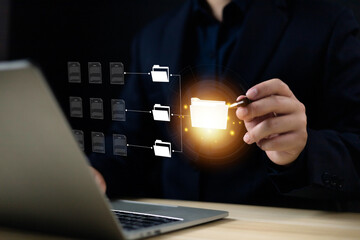Document management concept, Businessman show digital document management system virtual on laptop. Managing corporate file information, Efficient document management with technology for archiving.