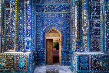 Samarkand, Uzbekistan - 05 June 2024: View of the Shah-i-Zinda necropolis entrance, adorned with intricate blue tilework and Arabic calligraphy, creating a mesmerizing spectacle of color and design.