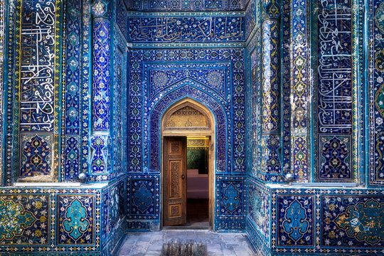 Samarkand, Uzbekistan - 05 June 2024: View of the Shah-i-Zinda necropolis entrance, adorned with intricate blue tilework and Arabic calligraphy, creating a mesmerizing spectacle of color and design.
