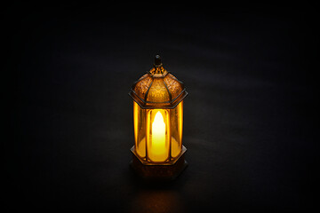 Islamic lanterns isolated on a dark background, the concept of Ramadan, Eid al-Fitr, and other Islamic holidays. Stunning Ramadan candle lanterns with free space