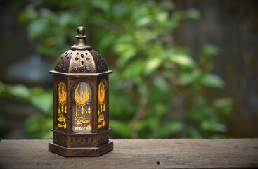 Islamic lanterns isolated on a dark background, the concept of Ramadan, Eid al-Fitr, and other Islamic holidays. Stunning Ramadan candle lanterns with free space