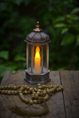 Islamic lanterns isolated on a dark background, the concept of Ramadan, Eid al-Fitr, and other Islamic holidays. Stunning Ramadan candle lanterns with free space