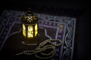Islamic lanterns isolated on a dark background, the concept of Ramadan, Eid al-Fitr, and other Islamic holidays. Stunning Ramadan candle lanterns with free space