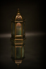 Islamic lanterns isolated on a dark background, the concept of Ramadan, Eid al-Fitr, and other Islamic holidays. Stunning Ramadan candle lanterns with free space