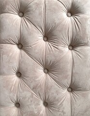 Close Up of Beige Tufted Fabric Texture with Padded Button Design Details