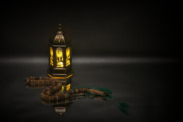 Islamic lanterns isolated on a dark background, the concept of Ramadan, Eid al-Fitr, and other Islamic holidays. Stunning Ramadan candle lanterns with free space