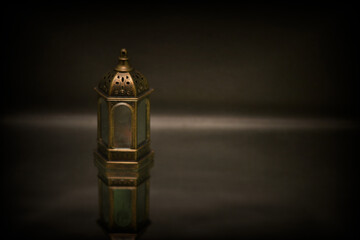 Islamic lanterns isolated on a dark background, the concept of Ramadan, Eid al-Fitr, and other Islamic holidays. Stunning Ramadan candle lanterns with free space