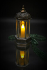 Islamic lanterns isolated on a dark background, the concept of Ramadan, Eid al-Fitr, and other Islamic holidays. Stunning Ramadan candle lanterns with free space
