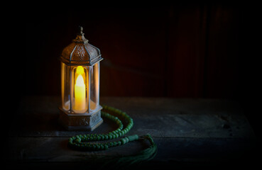 Islamic lanterns isolated on a dark background, the concept of Ramadan, Eid al-Fitr, and other Islamic holidays. Stunning Ramadan candle lanterns with free space