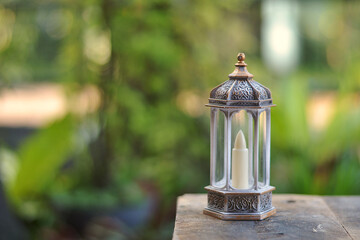 Islamic lanterns isolated on a dark background, the concept of Ramadan, Eid al-Fitr, and other Islamic holidays. Stunning Ramadan candle lanterns with free space