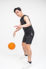 A talented young Asian man controlling the ball with confidence, dribbling while fending off...