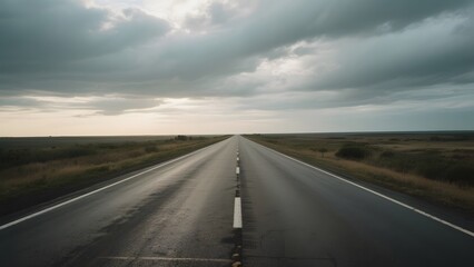 Straight Road Stretching into the Horizon Under a Cloudy Sky