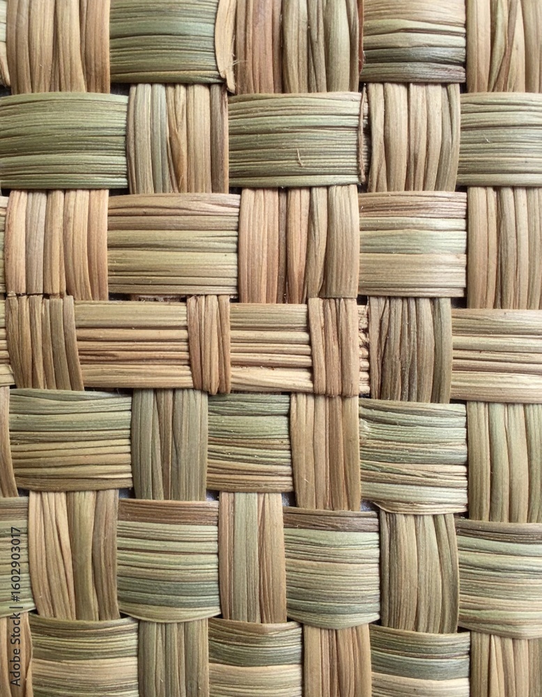 Poster close up of interwoven natural straw fibers creating a textured pattern