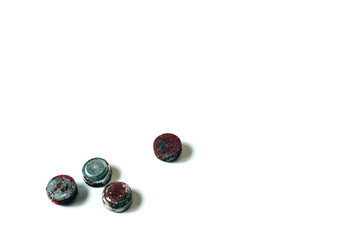 Corroded battery terminals on white background