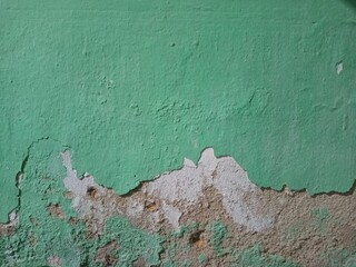 peeling paint on a damage wall