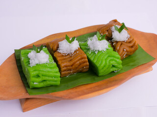 Getuk on wooden plate. Getuk is a traditional Indonesian snack made from mashed boiled cassava,...
