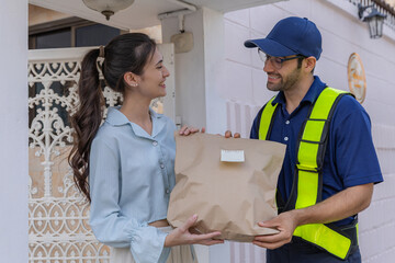 Delivery express courier young man use giving boxes or Food to woman customer  at front home