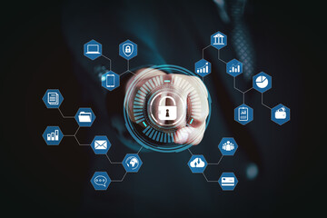 Cybersecurity concept showing hand pressing digital lock icon on futuristic interface with data...