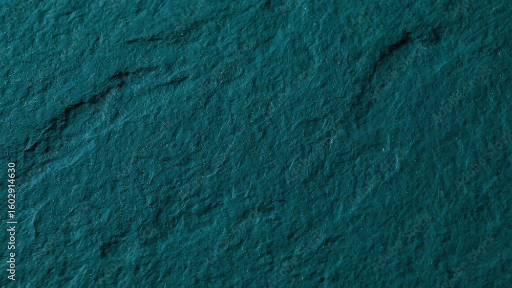Poster a teal surface with subtle texture and darker markings creating a natural abstract pattern view from