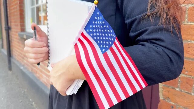 Young woman with American flag promoting English courses and education