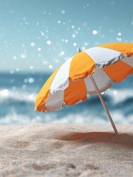 Orange and white striped beach umbrella on the sand.