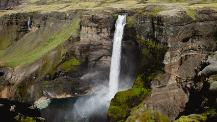 Majestic Haifoss Waterfall cascading against rocky cliffs in Iceland
