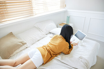 Obraz premium A Korean woman resting at home on holidays. 