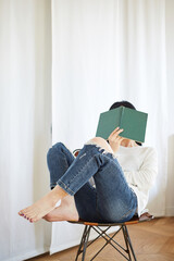 A Korean woman resting at home on holidays.
