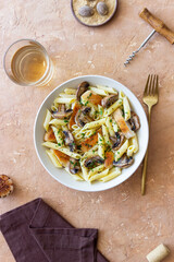 Penne pasta with chicken and mushrooms in creamy sauce. Italian cuisine. Recipe.