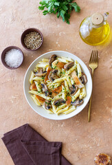 Penne pasta with chicken and mushrooms in creamy sauce. Italian cuisine. Recipe.