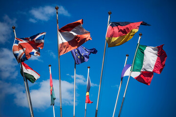 Flags of European countries blowing in strong breeze