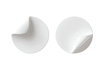 Two blank circular stickers with peeled corners