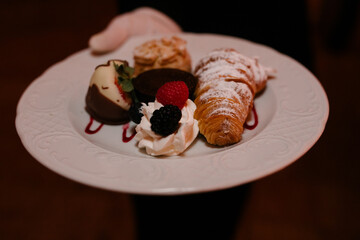 Dessert platter featuring rich sweets served elegantly at a formal event