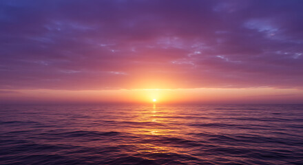 Fototapeta premium Vibrant sunset over a calm ocean, with a dramatic mix of purples and oranges in the sky.