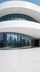 Obraz premium Modern Curved Building with Reflective Glass Facade