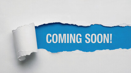 Exciting announcement reveal with bold 'Coming Soon' text on vibrant blue background, creating anticipation