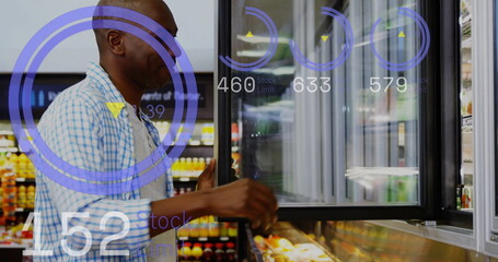 Reaching male shopper opening fridge door in supermarket aisle, selecting produce with AR overlays
