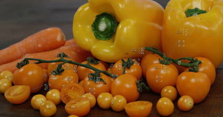 Displaying yellow bell peppers, carrots, cherry tomatoes on wood tabletop, with measuring overlays