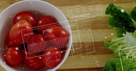 Ceramic bowl showing red tomatoes with lettuce on board in kitchen, with data overlays, copy space