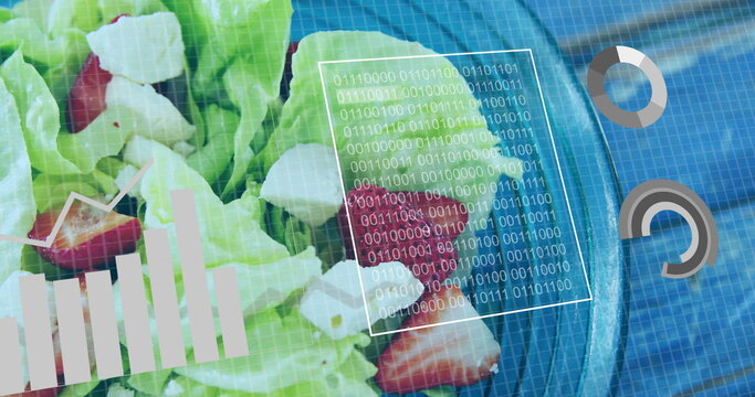 Displaying bowl of salad with lettuce strawberries cheese on blue table, with digital grid overlay