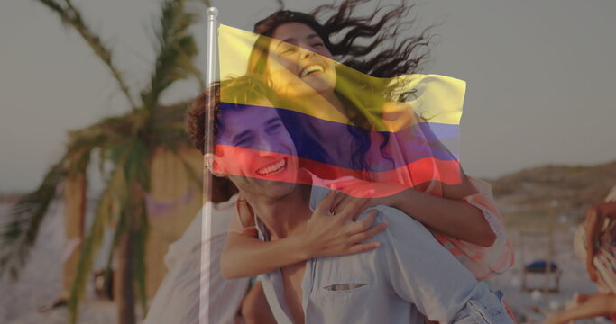 Laughing couple riding piggyback along sandy shore, with palm trees, thatch-roof huts and umbrellas