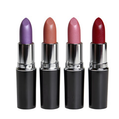 Four assorted lipsticks in a row isolated on transparent background