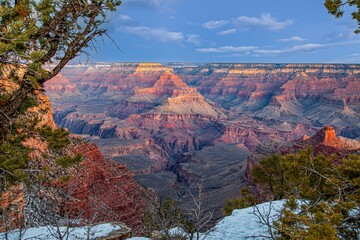Wide Grand Canyon panorama with snowy rim