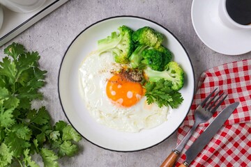 Fried egg with Broccoli and black coffee for morning breakfast