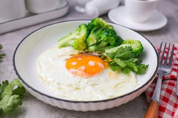 Fried egg with Broccoli and black coffee for morning breakfast